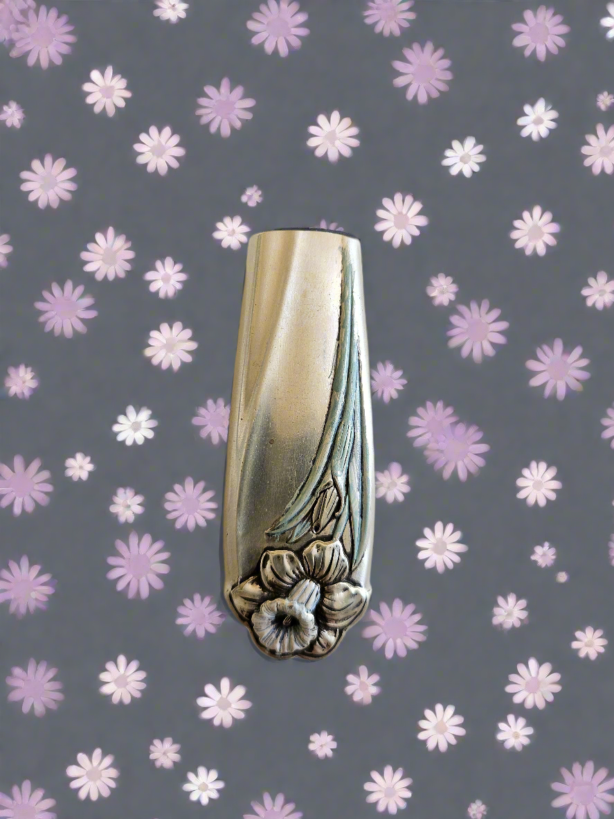 Whimsical bud vases crafted from vintage silverware with magnetic backs—perfect for single blooms and small clippings. Each one is a one-of-a-kind treasure.