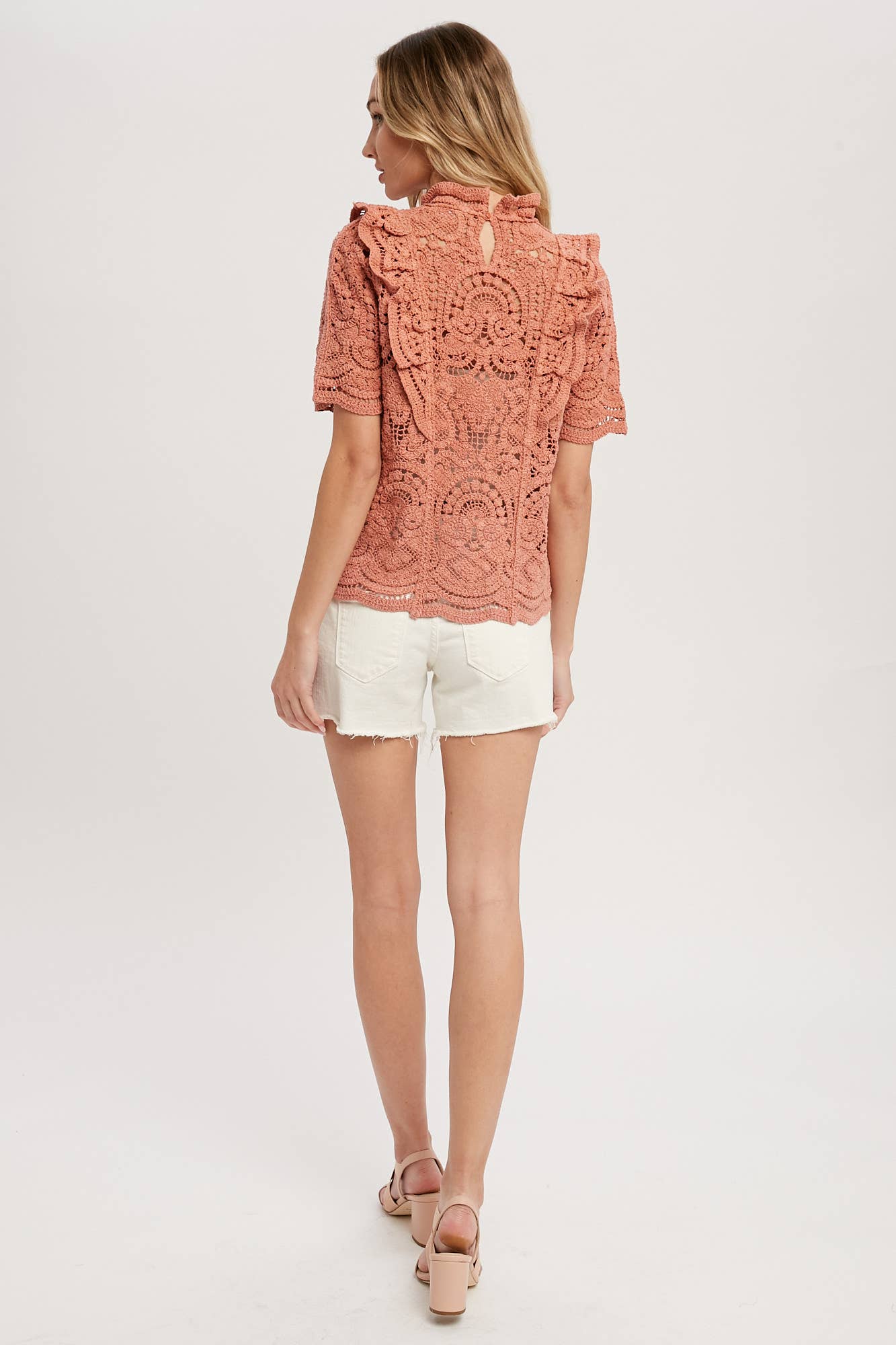 Romantic crochet lace top with frills, scalloped edges, and a relaxed fit. Perfect for layering over camis or dresses. A dreamy, vintage-inspired staple.