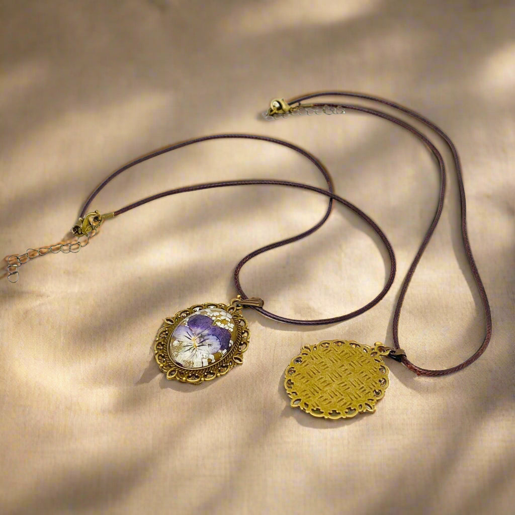 Palace Bloom Vintage Floral Necklace with real dried flowers in resin, antique-style pendant, and waxed rope chain. Lightweight, elegant, and one-of-a-kind.