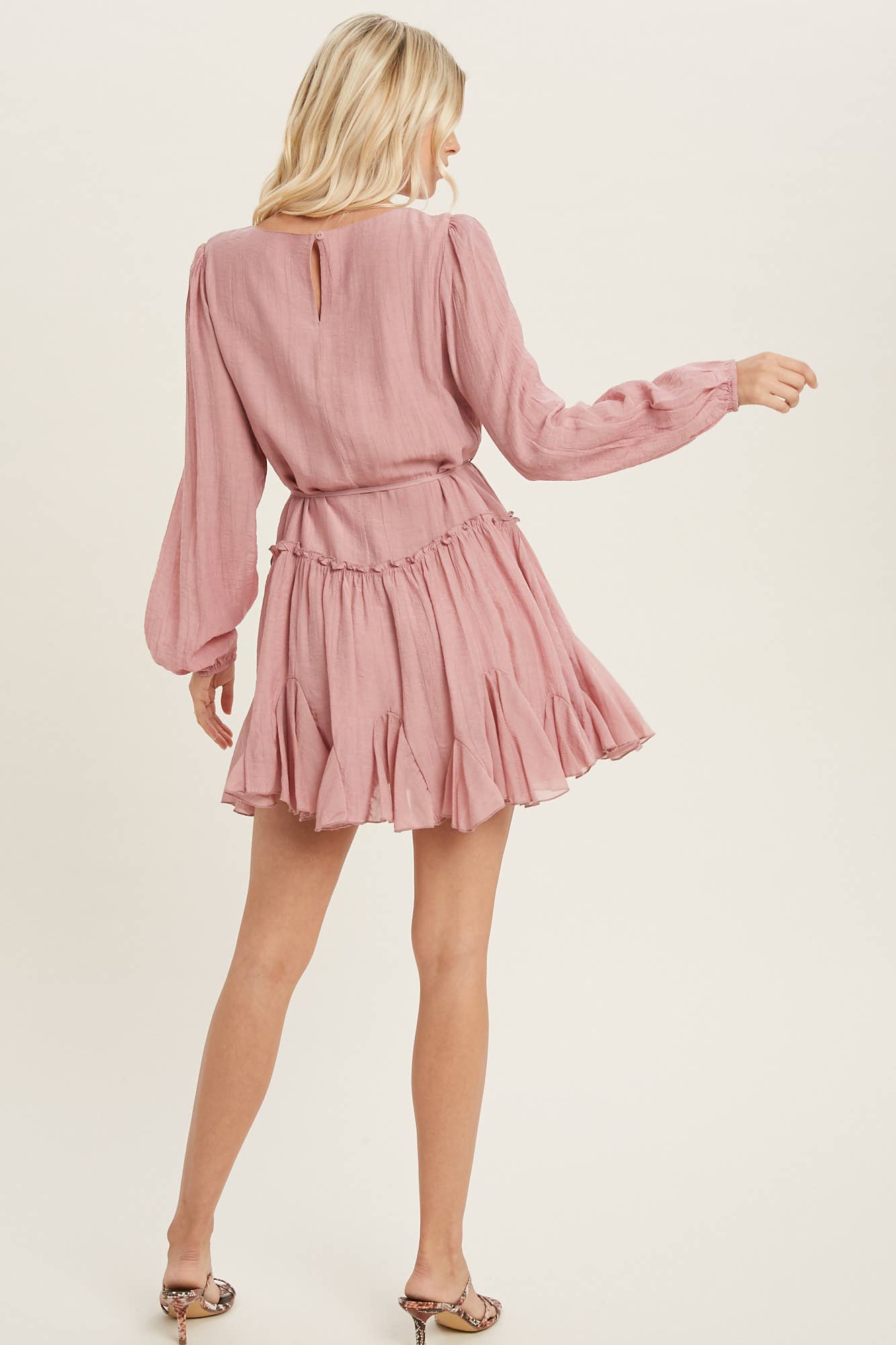 A flirty mini swing dress with balloon sleeves, ruffle trim, and adjustable waist. Lightweight, breathable, and perfect for everyday whimsy.
