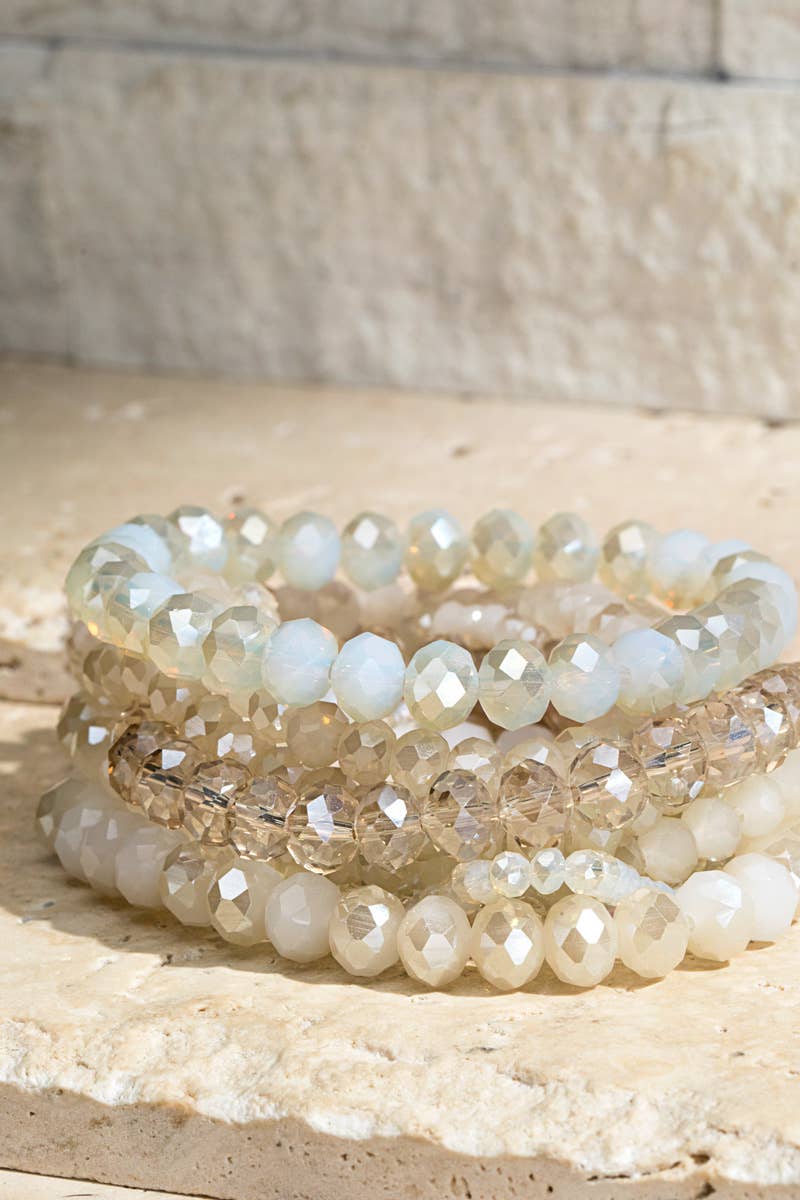 Shimmer in style with this 9-piece faceted glass bead bracelet set. Stack for bold elegance or wear solo for a touch of sparkle. Nickel & lead compliant!