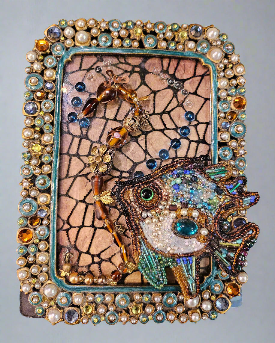 Add a splash of nautical charm with Jeweled Fish Frames, featuring handcrafted aquatic motifs in high-quality beads, glass, wood, and metal. These 4" x 6" frames blend intricate craftsmanship with vintage-inspired elegance, making them perfect for walls, shelves, or gallery displays. A unique decor statement!