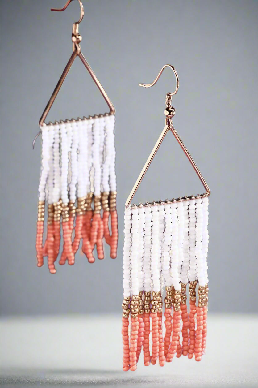 Make a statement with these coral, gold, and white beaded fringe earrings. Lightweight, hypoallergenic, and stylish—perfect for any look, day or night!