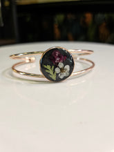 Handcrafted floral resin bracelets with real dried flowers. Unique, nature-inspired jewelry that adds whimsical charm and elegance to any outfit.