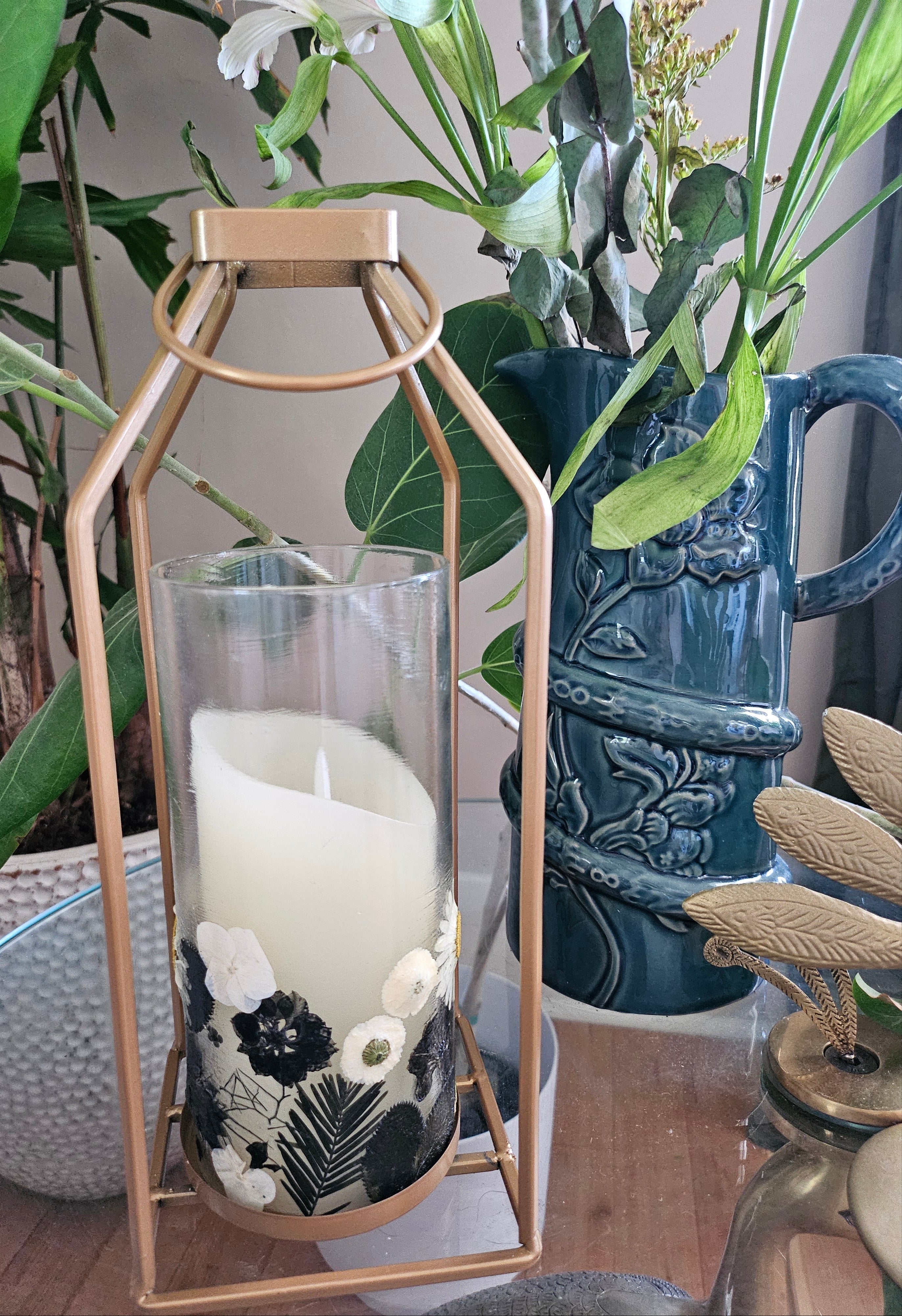 Fairy Pressed Flower Lantern with gold frame & glass panels glows with soft candlelight through real black & white flowers. 12" tall, perfect for spa or gift.