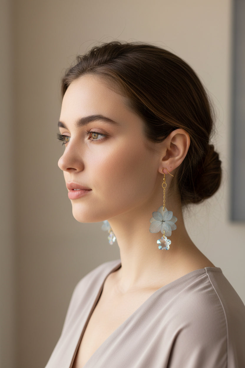 Real dried flower drop earrings preserved in resin with sparkling crystal accents. Romantic botanical jewelry with a delicate, one-of-a-kind garden feel.