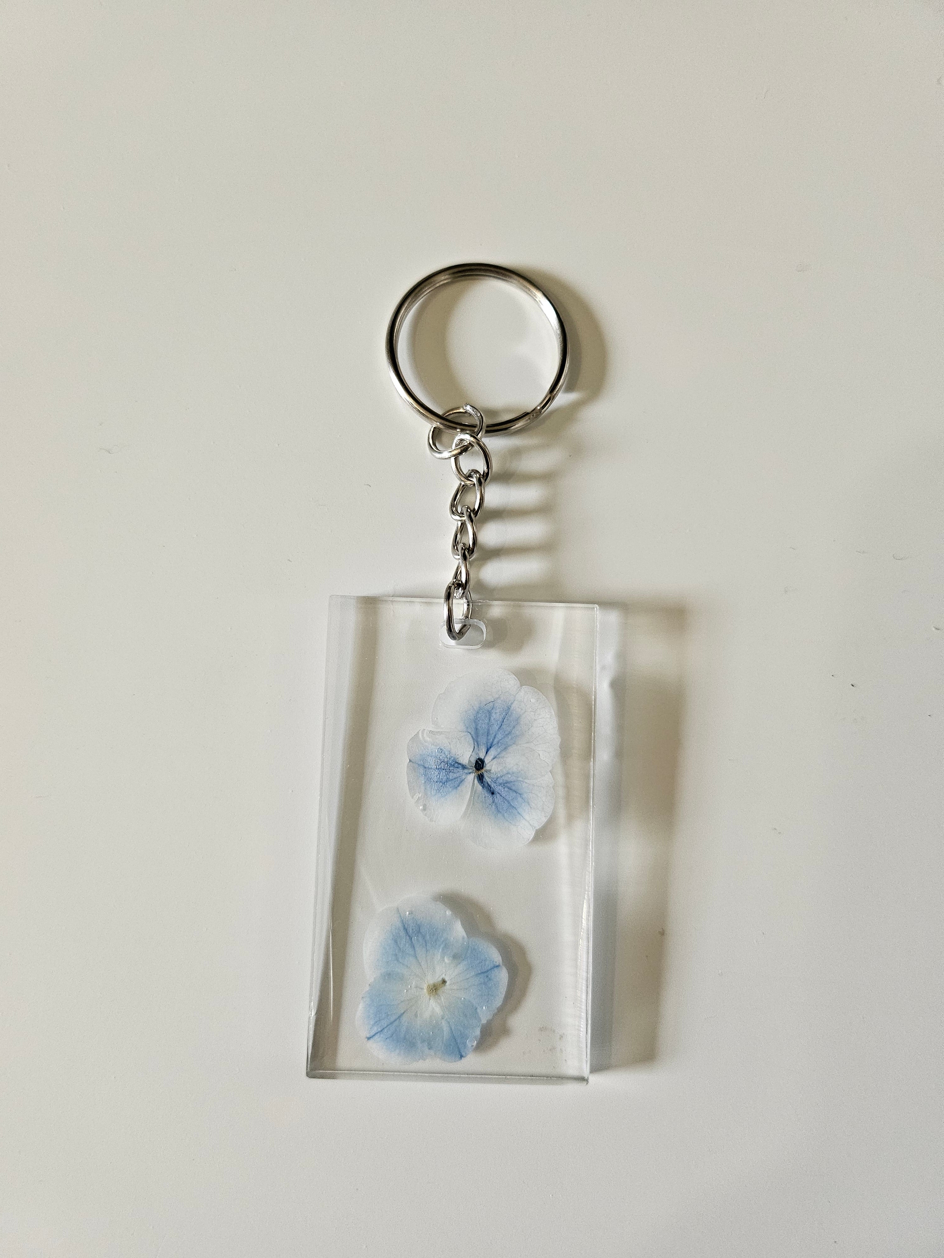 These Resin Pressed Flowers Keychains are handcrafted with real dried flowers suspended in crystal-clear resin.