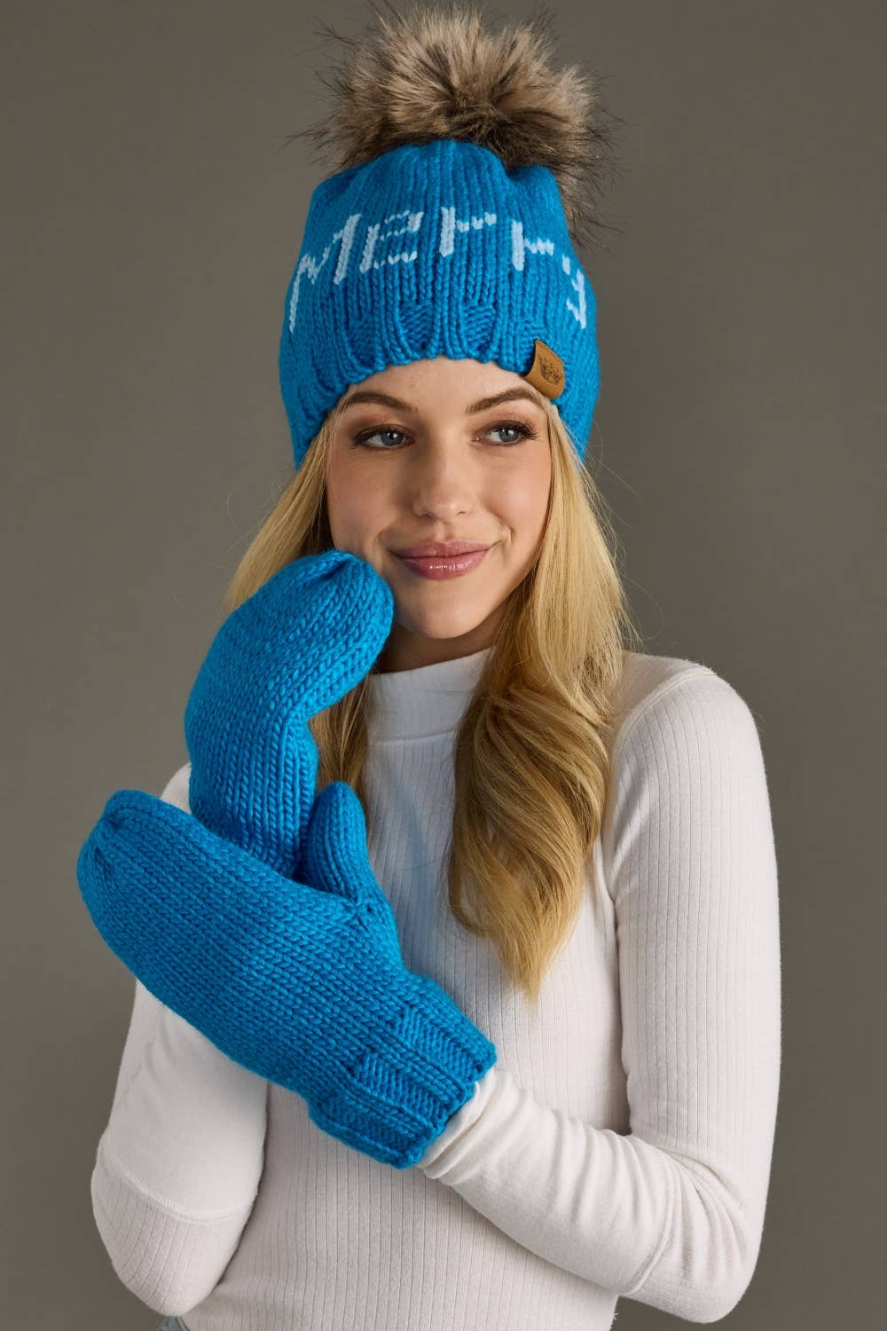 Keep hands cozy with Blue Knit Mittens featuring soft fleece lining and 100% acrylic knit. A classic winter accessory for chilly walks, snowy days, and gifting.