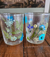 Fairy Tea Candles: Decorative Dried Flower Tea Candles and Votive Holders 2.5"x2" add elegance to any space. Perfect for tea parties, dinners, or meditation, they include Set & Setting Love in Merry and Bright Tea Light Candles with champagne, balsam fir, and moss scents. Stylish, low-maintenance, and ideal as gifts for any occasion.