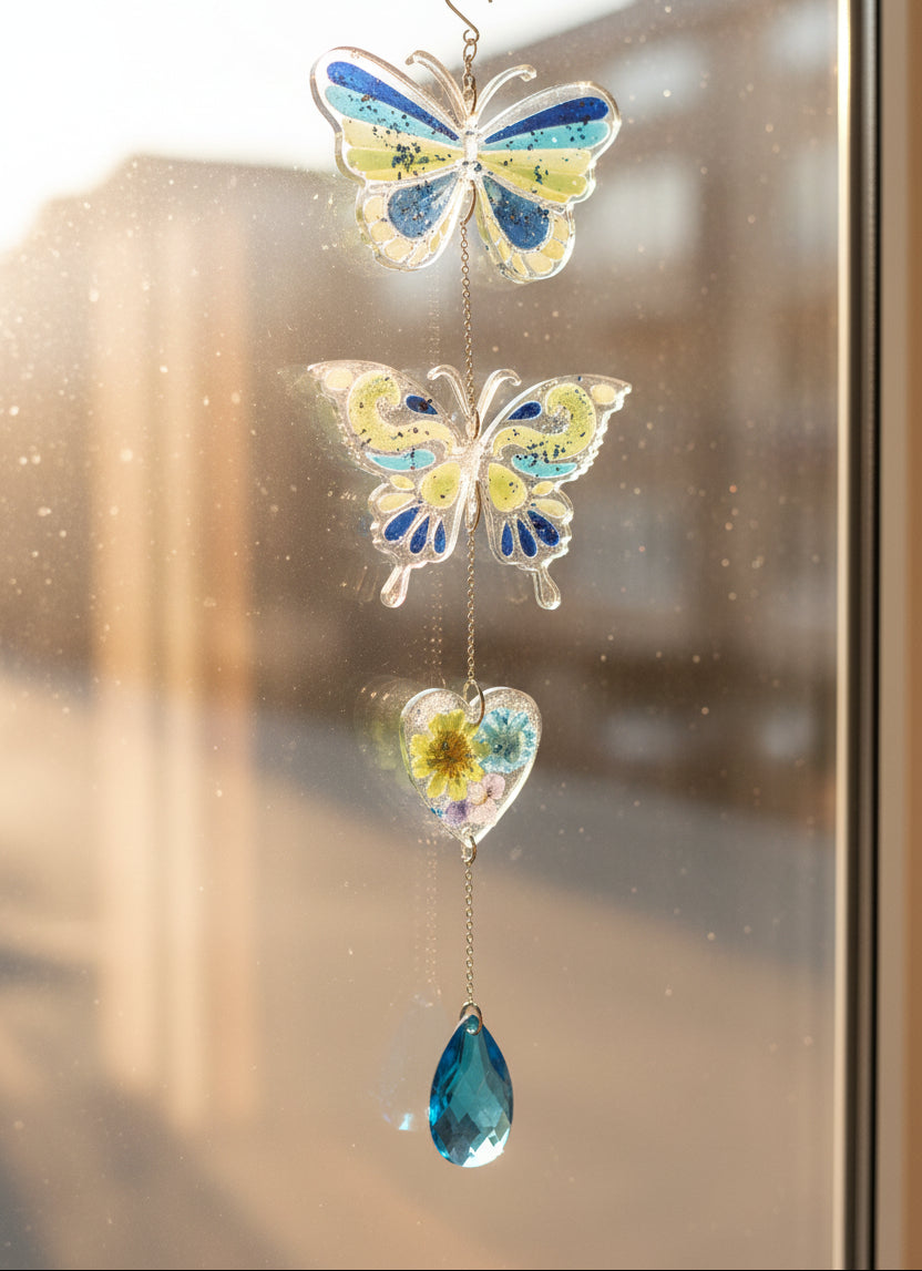 Handmade butterfly suncatchers with real pressed flowers and crystal chain. Reflects sunlight into rainbows—perfect for windows or near plants.