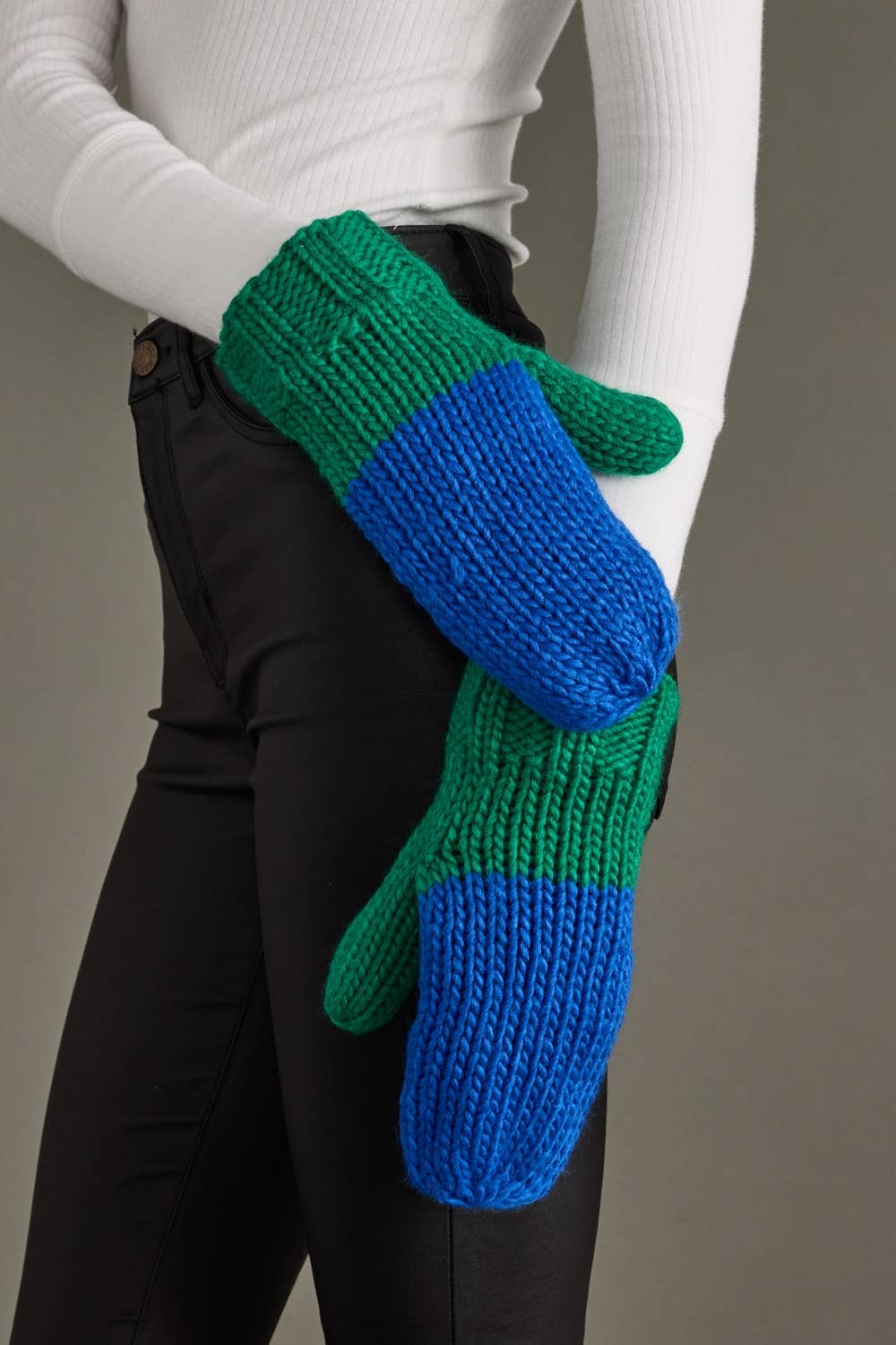 Blue and green color block knit mittens by Panache Apparel Co. Made from 100% acrylic with cozy fleece lining for warmth and colorful winter style.