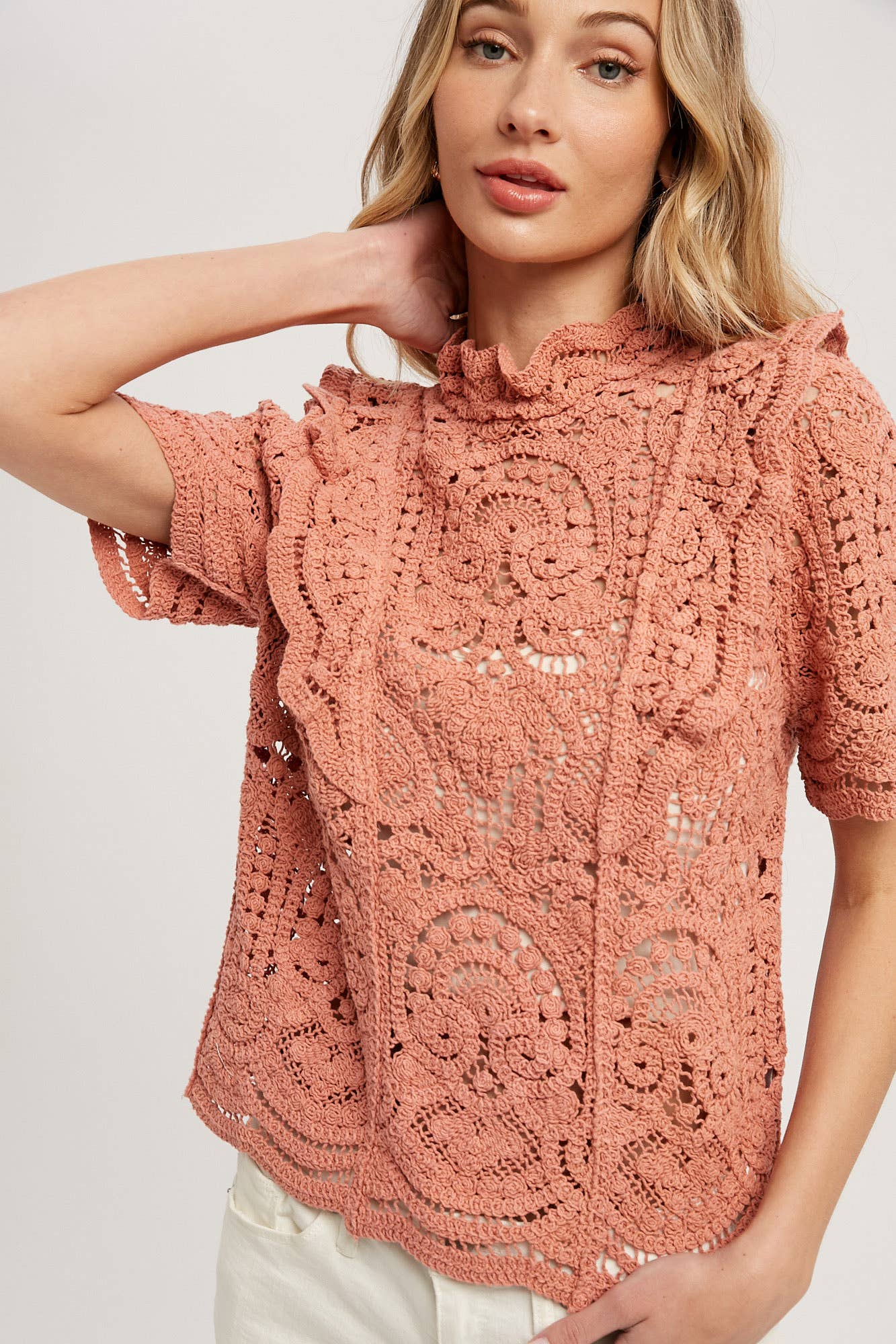 Romantic crochet lace top with frills, scalloped edges, and a relaxed fit. Perfect for layering over camis or dresses. A dreamy, vintage-inspired staple.