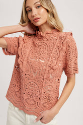 Romantic crochet lace top with frills, scalloped edges, and a relaxed fit. Perfect for layering over camis or dresses. A dreamy, vintage-inspired staple.