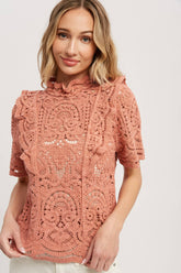 Romantic crochet lace top with frills, scalloped edges, and a relaxed fit. Perfect for layering over camis or dresses. A dreamy, vintage-inspired staple.