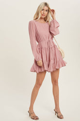 A flirty mini swing dress with balloon sleeves, ruffle trim, and adjustable waist. Lightweight, breathable, and perfect for everyday whimsy.