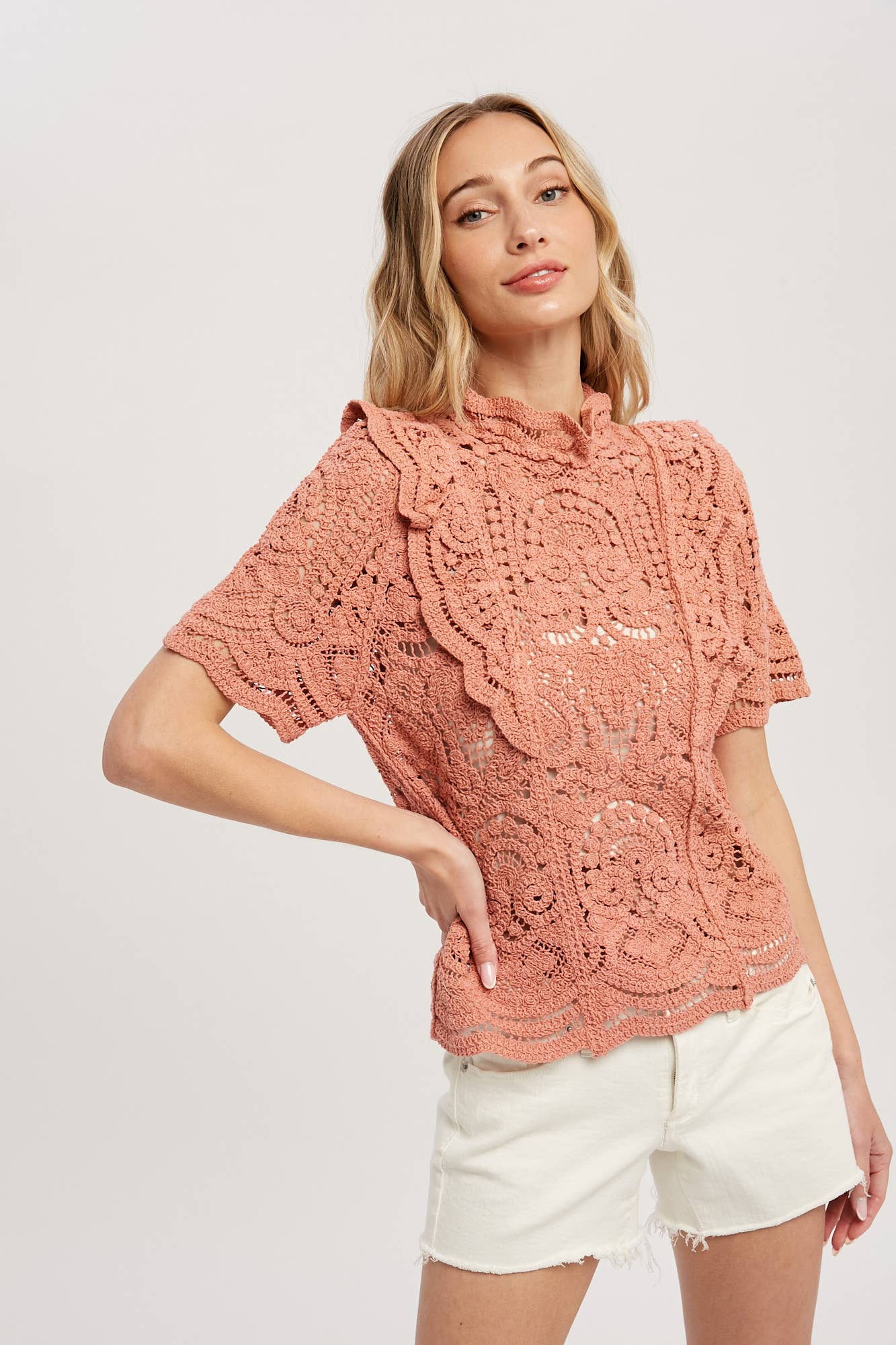 Romantic crochet lace top with frills, scalloped edges, and a relaxed fit. Perfect for layering over camis or dresses. A dreamy, vintage-inspired staple.