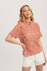 Romantic crochet lace top with frills, scalloped edges, and a relaxed fit. Perfect for layering over camis or dresses. A dreamy, vintage-inspired staple.