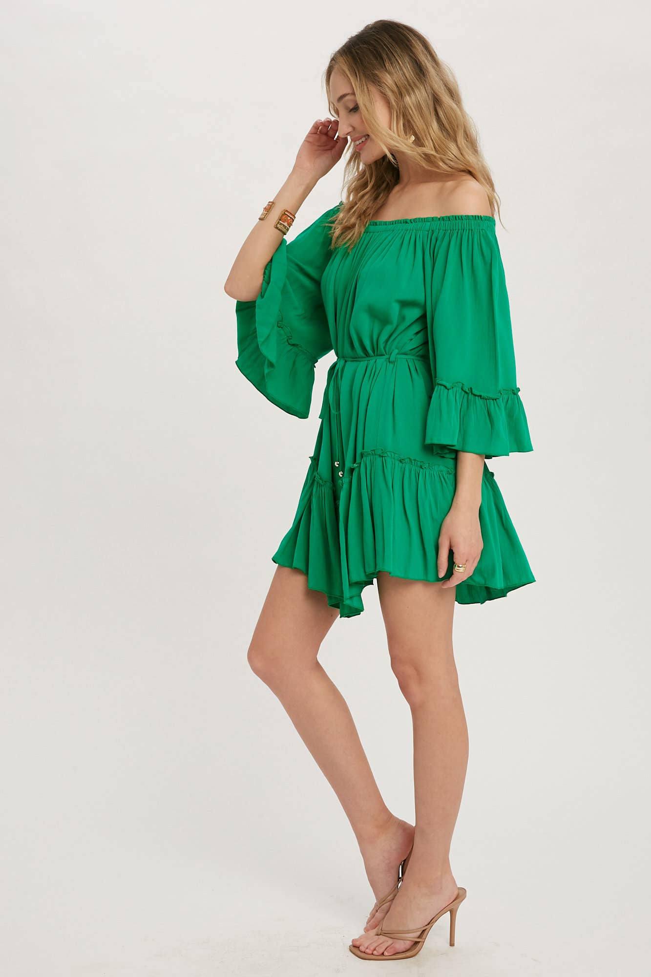 Romantic off-shoulder dress with ruffled sleeves, frilled hem, and a swingy silhouette. Adjustable belt adds shape to this breezy, flounce favorite.