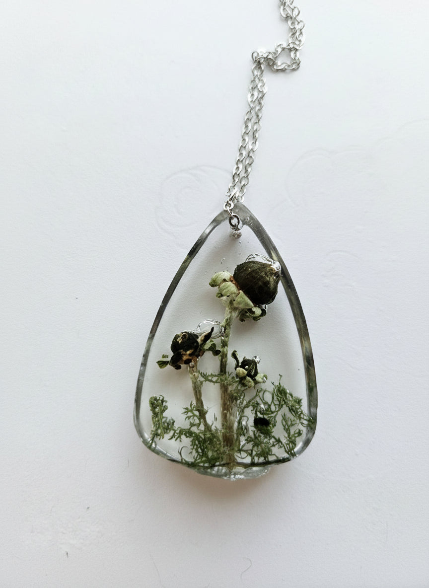 Gathered-in-the-Wild Botanical Necklace with real foraged flowers, mushrooms, pine needles, and leaves preserved in resin. Handcrafted wearable nature art by KStonely.