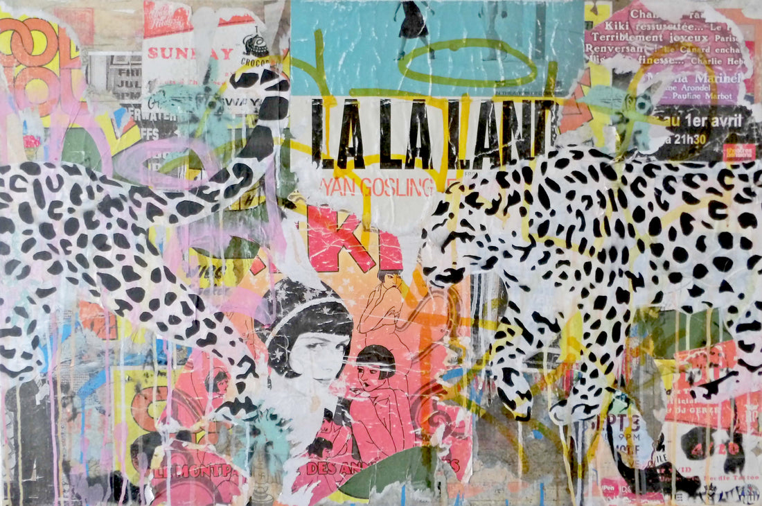 Camouflage is a 24"x36" mixed media artwork blending urban street art with nature. Featuring bold leopard silhouettes against a vibrant, layered backdrop of posters and graffiti, it explores themes of adaptation and identity. Ideal for contemporary spaces, pair it with a Bird of Paradise plant for a lively, dynamic vibe.