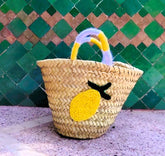 Cheerful straw tote with crocheted lemon patch and colorful handles. Lightweight, eco-friendly, and perfect for markets, beach days, or sunny adventures.