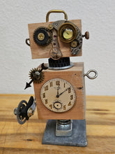 The Handmade Wood Block Steampunk Robot is a unique, decorative figurine crafted from wood with an aged, rustic look. Each robot is one-of-a-kind for display only. Includes a heart-shaped balloon. Available in various sizes, it&