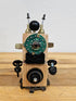 The Handmade Wood Block Steampunk Robot is a unique, decorative figurine crafted from wood with an aged, rustic look. Each robot is one-of-a-kind for display only. Includes a heart-shaped balloon. Available in various sizes, it&
