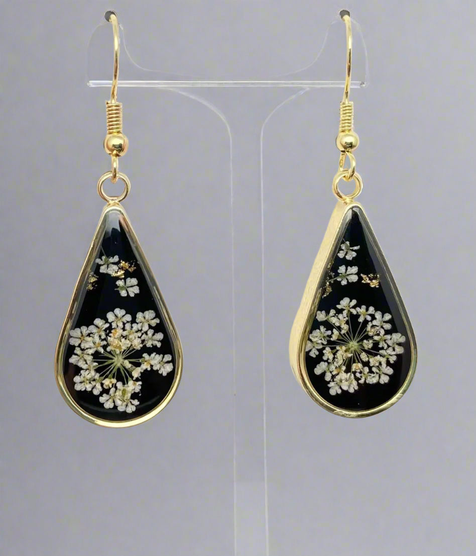 Dark Botanica earrings showcase real Queen Anne’s Lace in black resin teardrop earrings with gold-plated frames—bold, elegant earrings that are naturally one-of-a-kind.