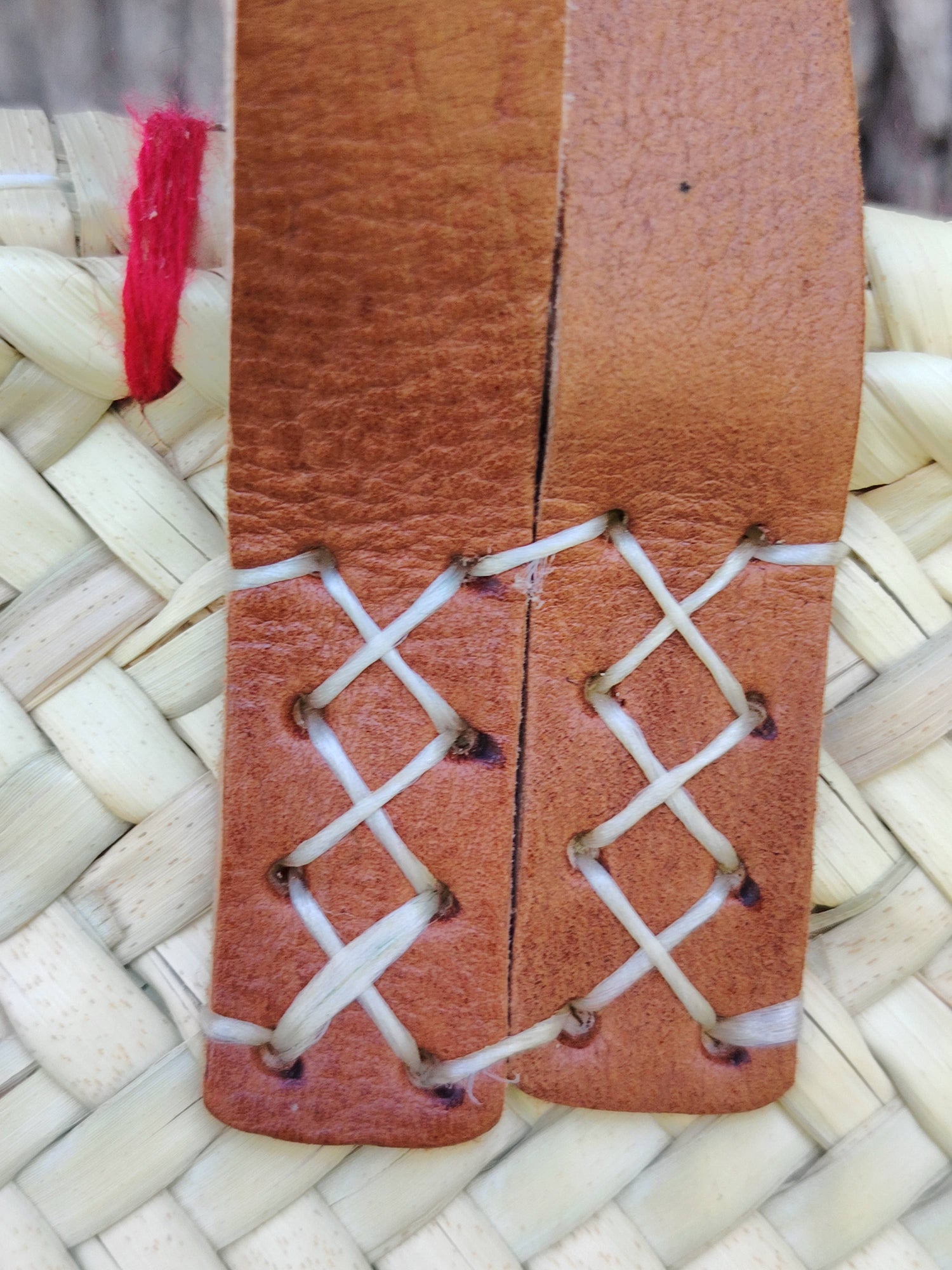 Handwoven straw tote with red crochet hearts and leather handles. Eco-friendly, artisan-made, and perfect for markets, gifting, or seasonal outings.