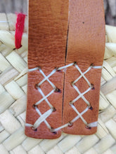 Handwoven straw tote with red crochet hearts and leather handles. Eco-friendly, artisan-made, and perfect for markets, gifting, or seasonal outings.