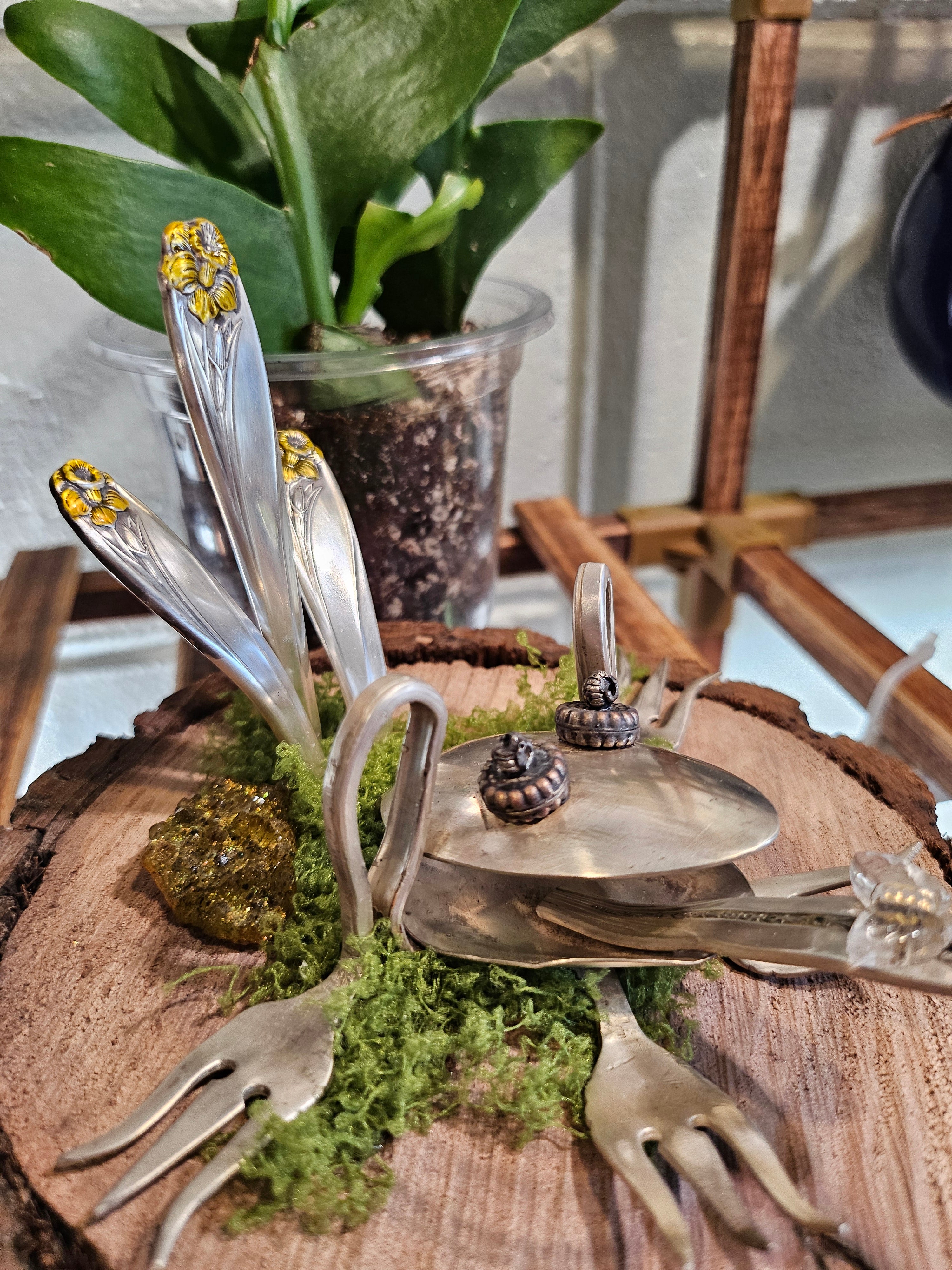 Handcrafted frog sculpture from vintage silverware, set on walnut wood with moss and crystals. A whimsical, one-of-a-kind piece for home or garden décor.
