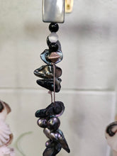 Add coastal charm to your space with the Shell & Bead Bohemian Suncatcher. Handcrafted with natural shells, semi-precious stones, and beads, it captures sunlight to create a stunning display of light and texture, perfect for windows, gardens, or as a unique, nature-inspired gift.