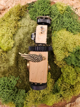 The Handmade Wood Block Steampunk Robot is a unique, decorative figurine crafted from wood with an aged, rustic look. Each robot is one-of-a-kind for display only. Includes a heart-shaped balloon. Available in various sizes, it&