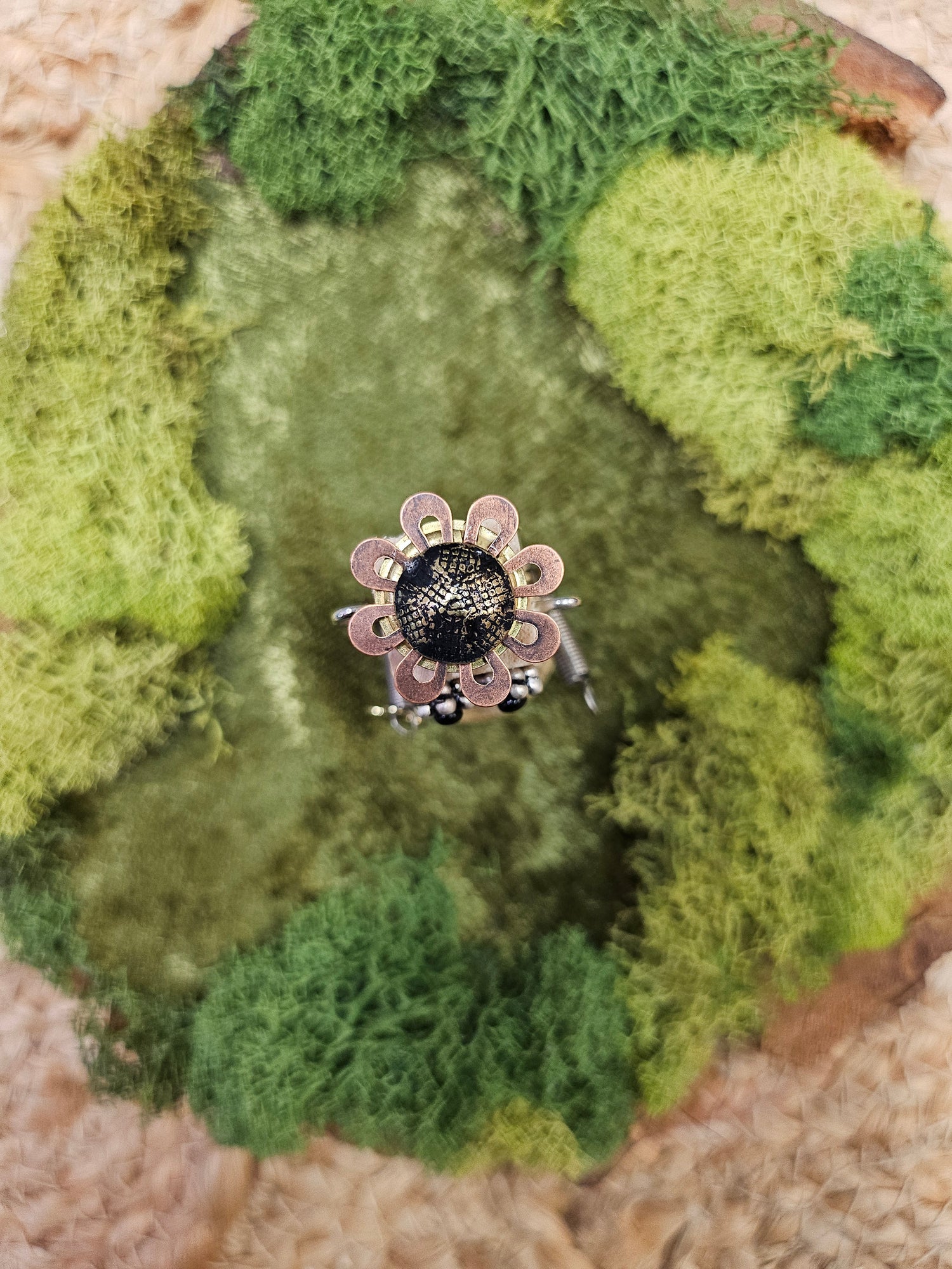 The Handmade Wood Block Steampunk Robot is a unique, decorative figurine crafted from wood with an aged, rustic look. Each robot is one-of-a-kind for display only. Includes a heart-shaped balloon. Available in various sizes, it&