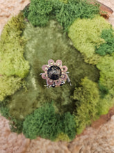 The Handmade Wood Block Steampunk Robot is a unique, decorative figurine crafted from wood with an aged, rustic look. Each robot is one-of-a-kind for display only. Includes a heart-shaped balloon. Available in various sizes, it&