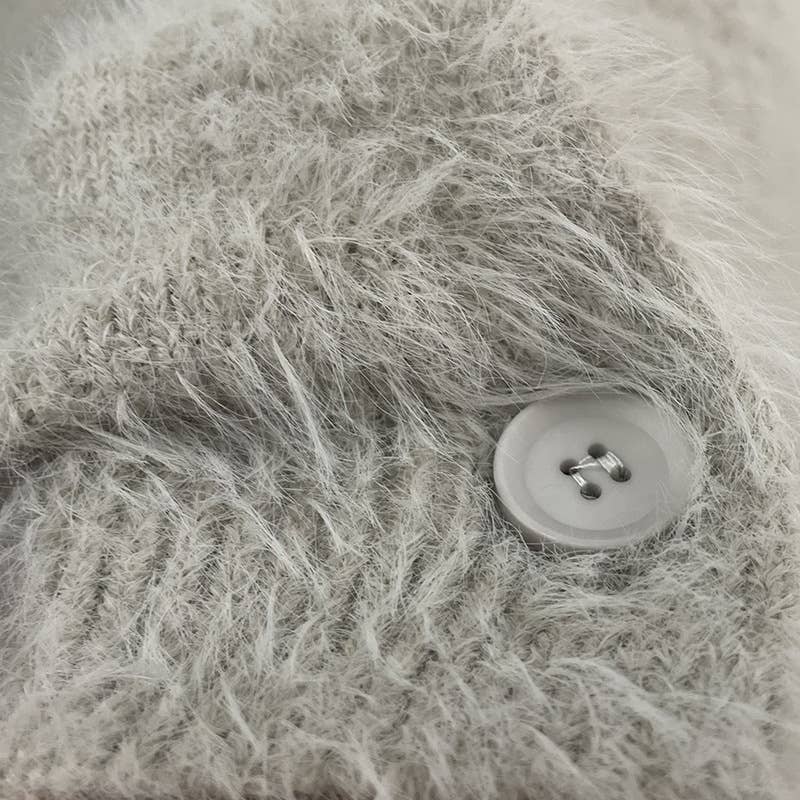 Luxuriously soft fluffy V-neck button-down cardigan with relaxed fit and cozy texture. Wear on or off shoulder—perfect for chic fall and winter layering.