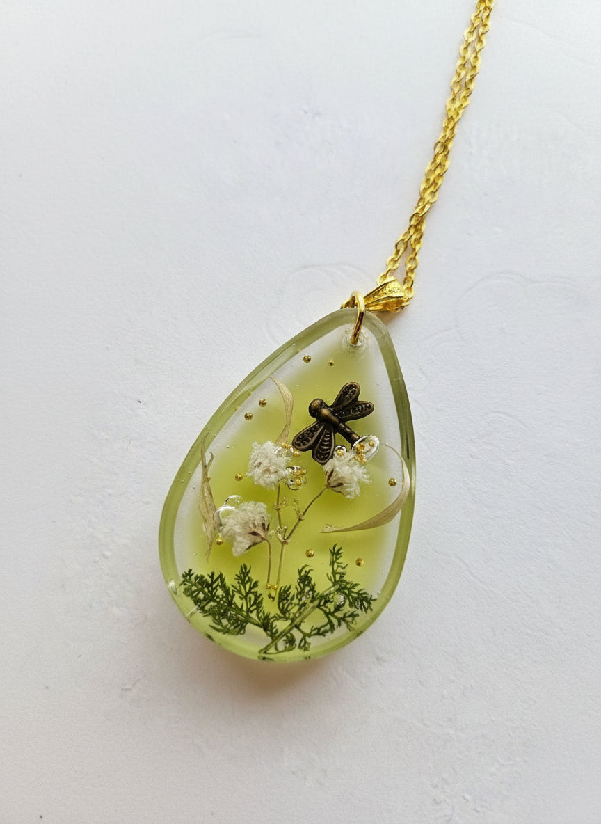 Gathered-in-the-Wild Botanical Necklace with real foraged flowers, mushrooms, pine needles, and leaves preserved in resin. Handcrafted wearable nature art by KStonely.