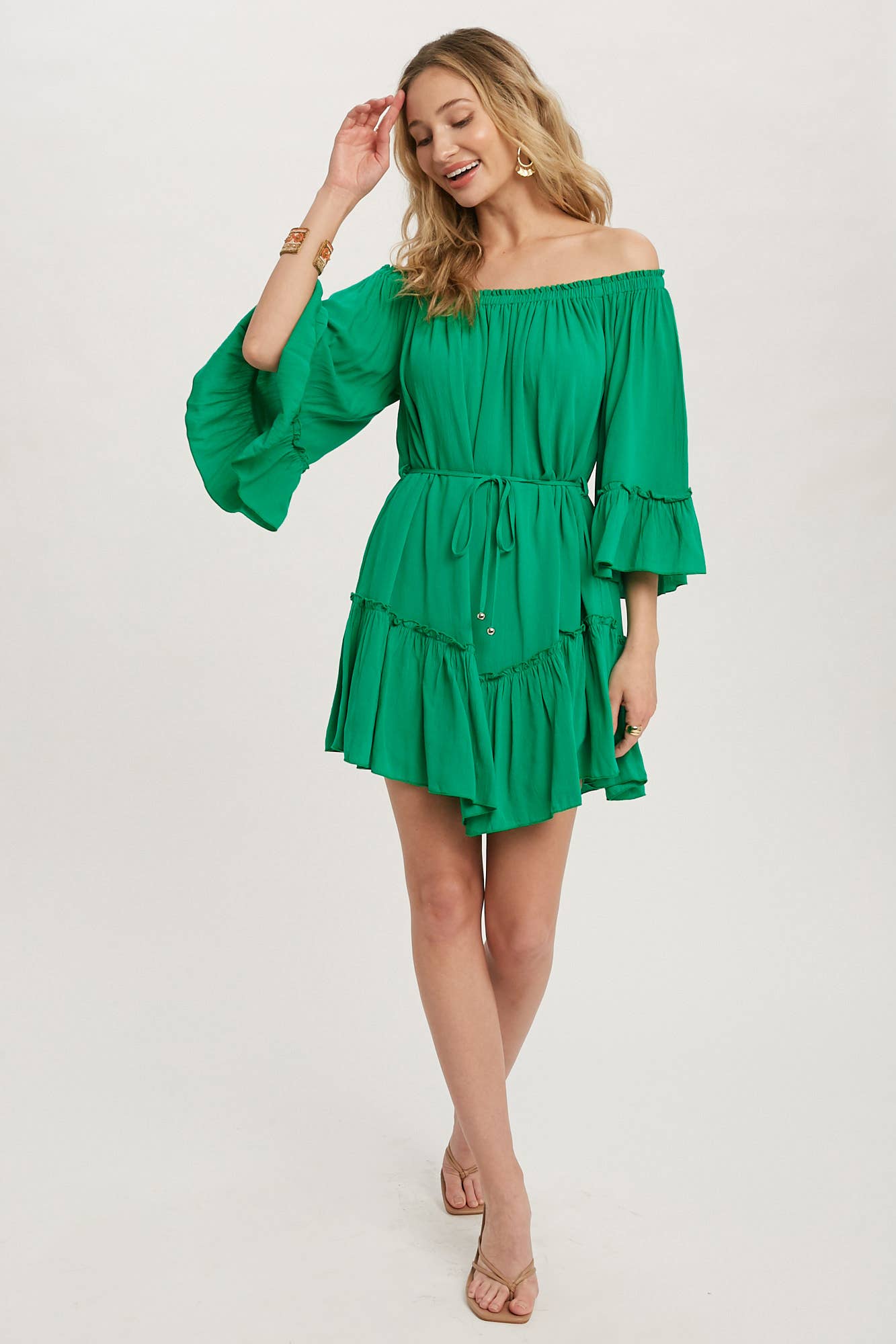 Romantic off-shoulder dress with ruffled sleeves, frilled hem, and a swingy silhouette. Adjustable belt adds shape to this breezy, flounce favorite.