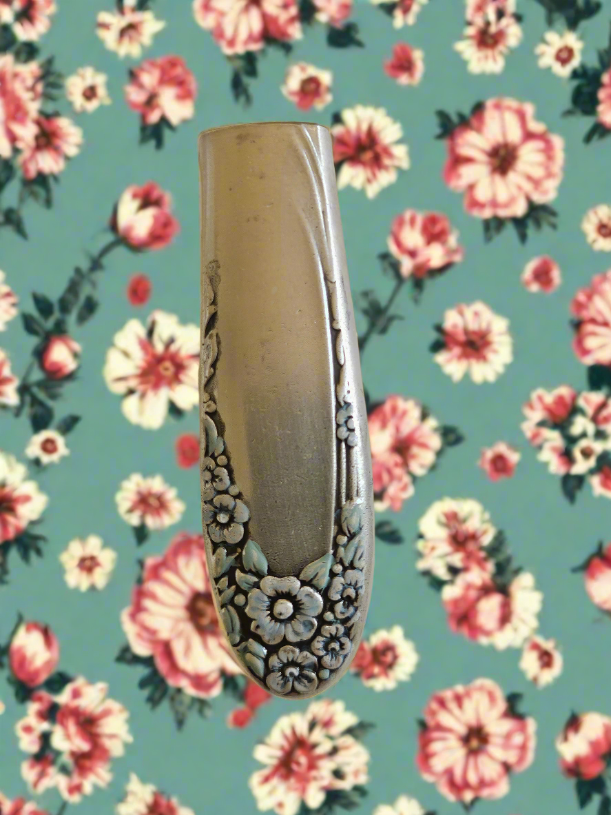 Whimsical bud vases crafted from vintage silverware with magnetic backs—perfect for single blooms and small clippings. Each one is a one-of-a-kind treasure.