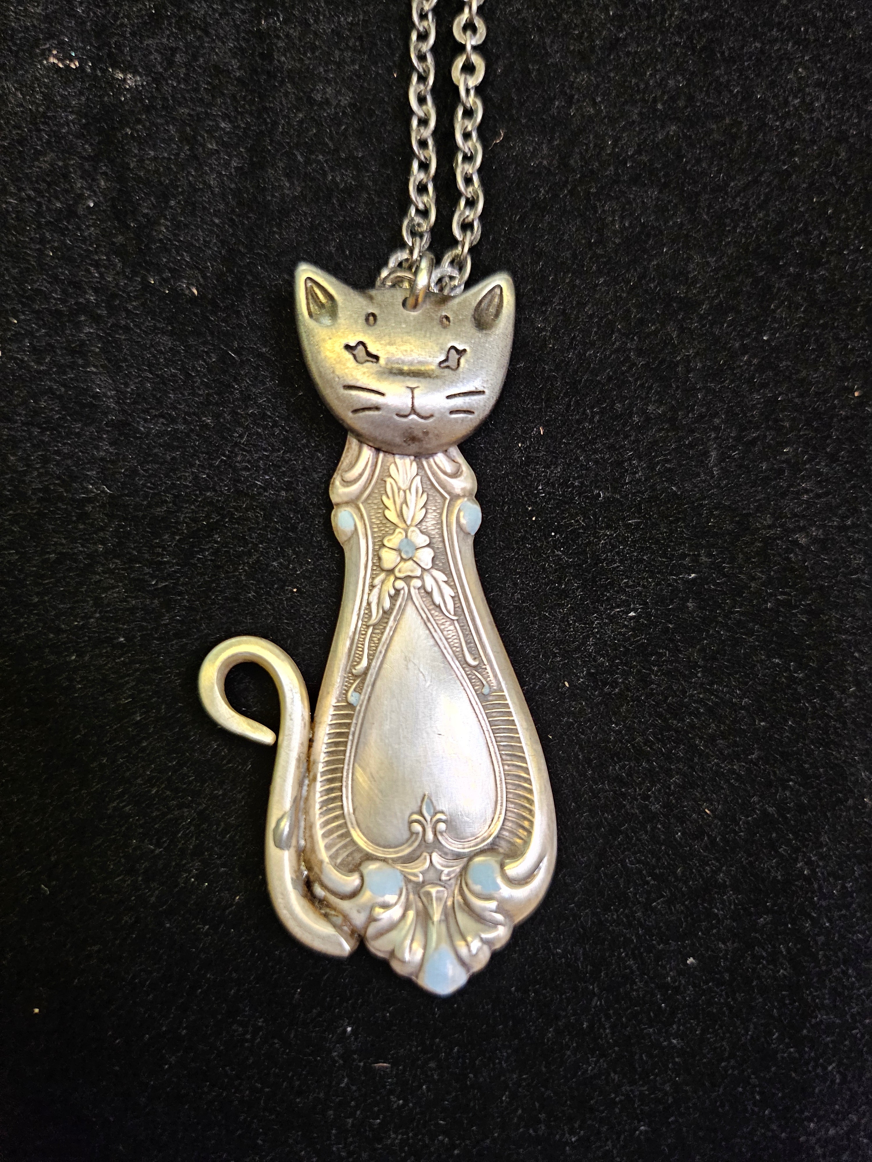 Handmade silver sassy cat pendant necklaces from vintage silverware. Elegant, whimsical, and adjustable on a satin cord. Sustainably crafted and one-of-a-kind.