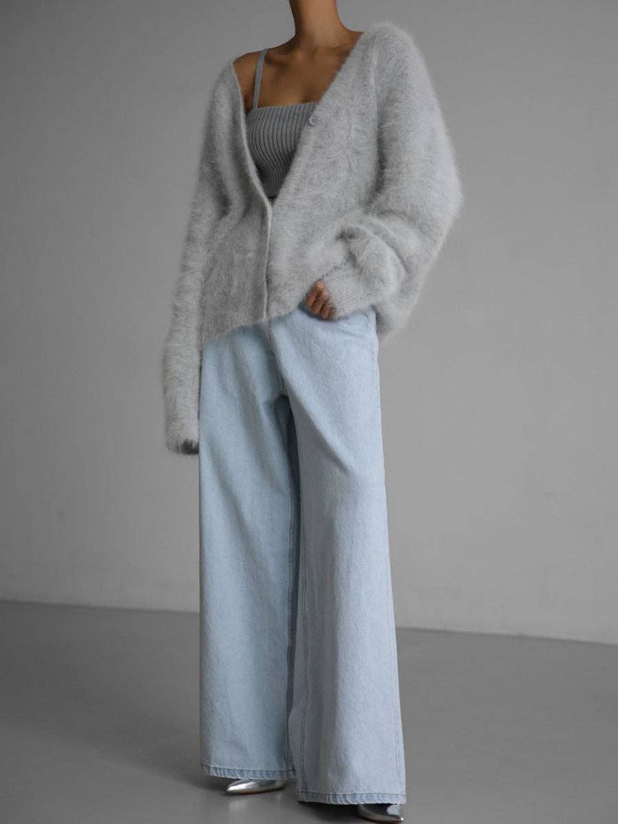 Luxuriously soft fluffy V-neck button-down cardigan with relaxed fit and cozy texture. Wear on or off shoulder—perfect for chic fall and winter layering.