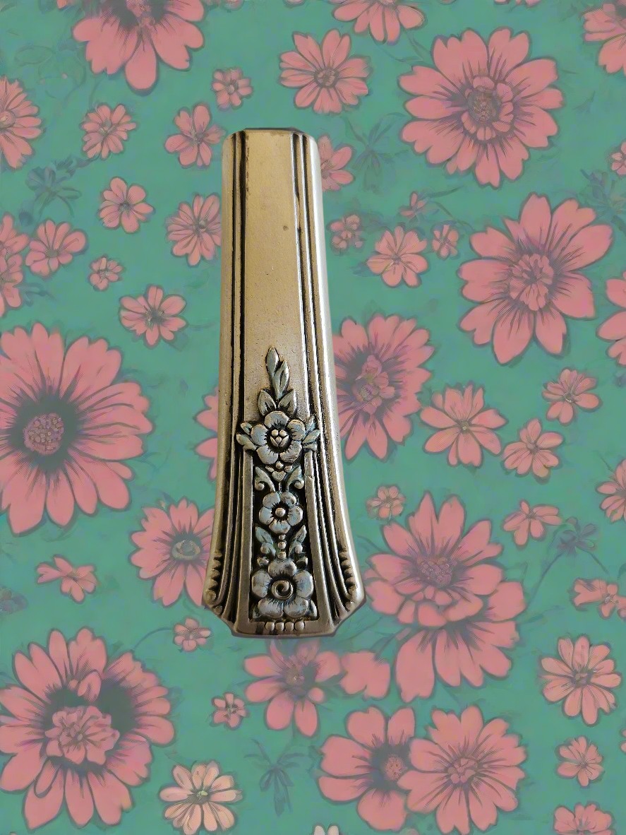 Whimsical bud vases crafted from vintage silverware with magnetic backs—perfect for single blooms and small clippings. Each one is a one-of-a-kind treasure.