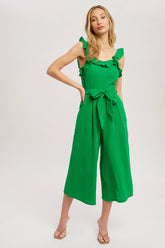 Chic textured cotton jumpsuit with frill trim, wide-leg fit, side pockets, self-tie waist, and back zipper. A relaxed, flattering one-piece for any season.
