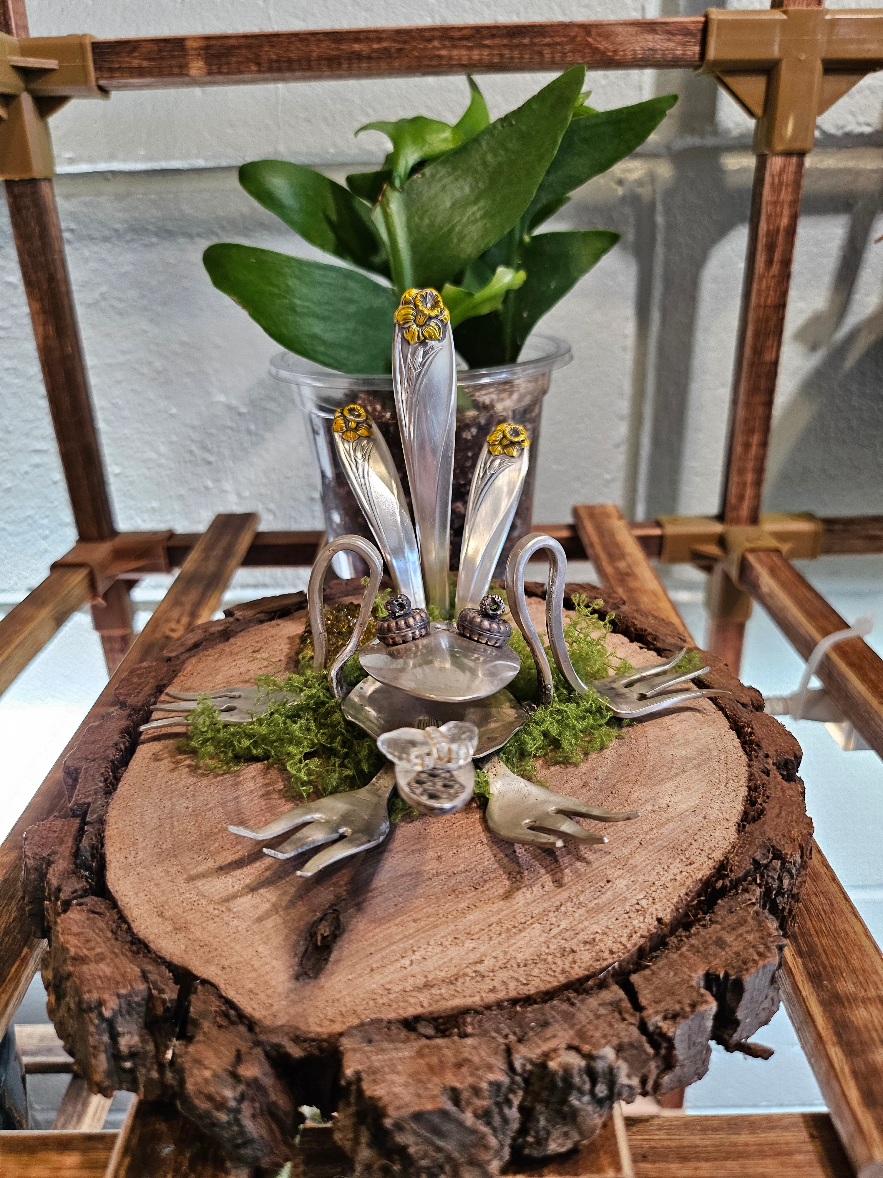 Handcrafted frog sculpture from vintage silverware, set on walnut wood with moss and crystals. A whimsical, one-of-a-kind piece for home or garden décor.