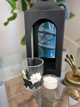 Botanical black fairy lantern with real pressed flowers and floral-scented tea lights. Perfect for witchy rituals, altars, and moody, magical spaces.