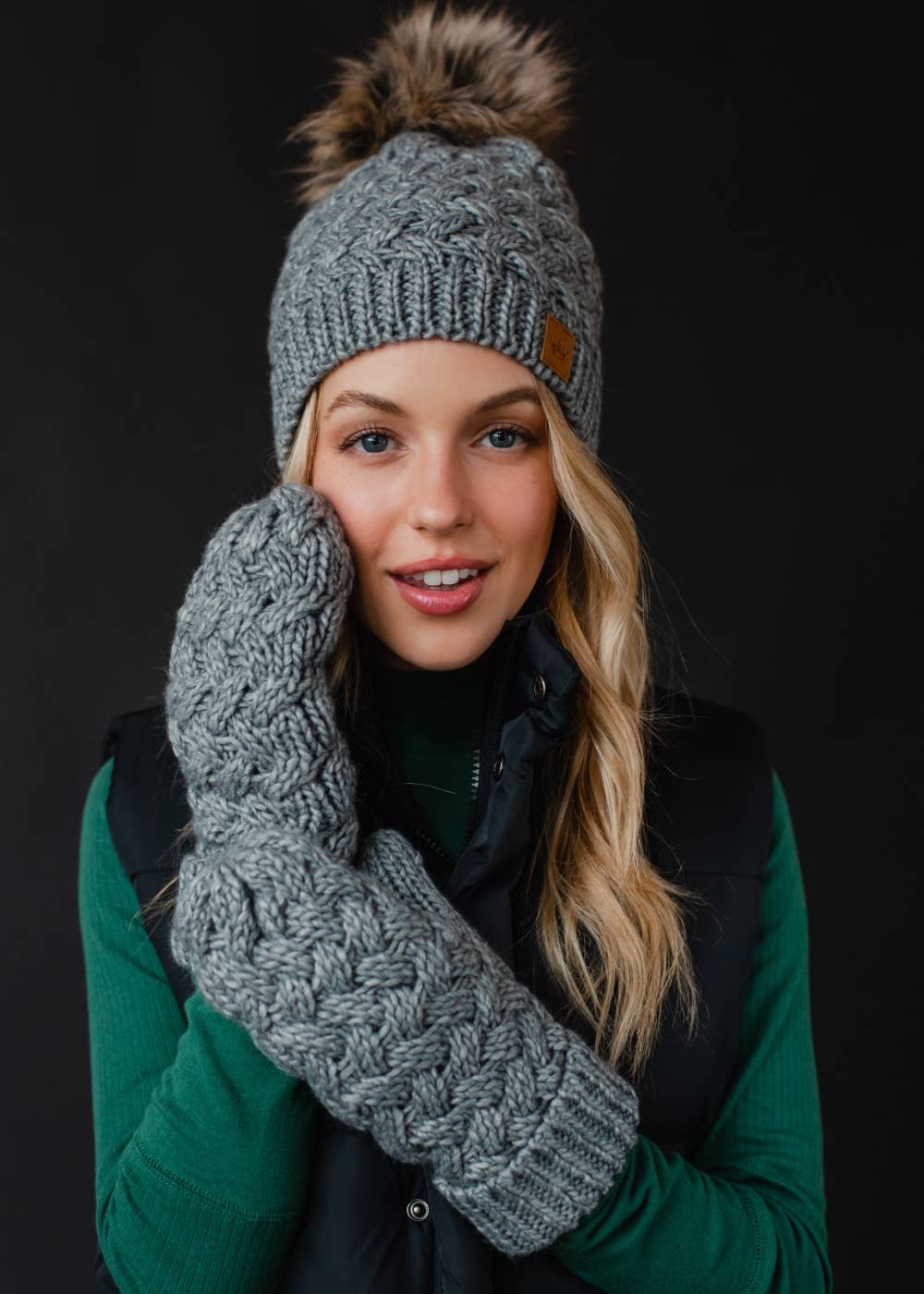Gray knit mittens with cozy fleece lining. Made from 100% acrylic for warmth and durability. A classic winter essential for everyday cold-weather comfort.