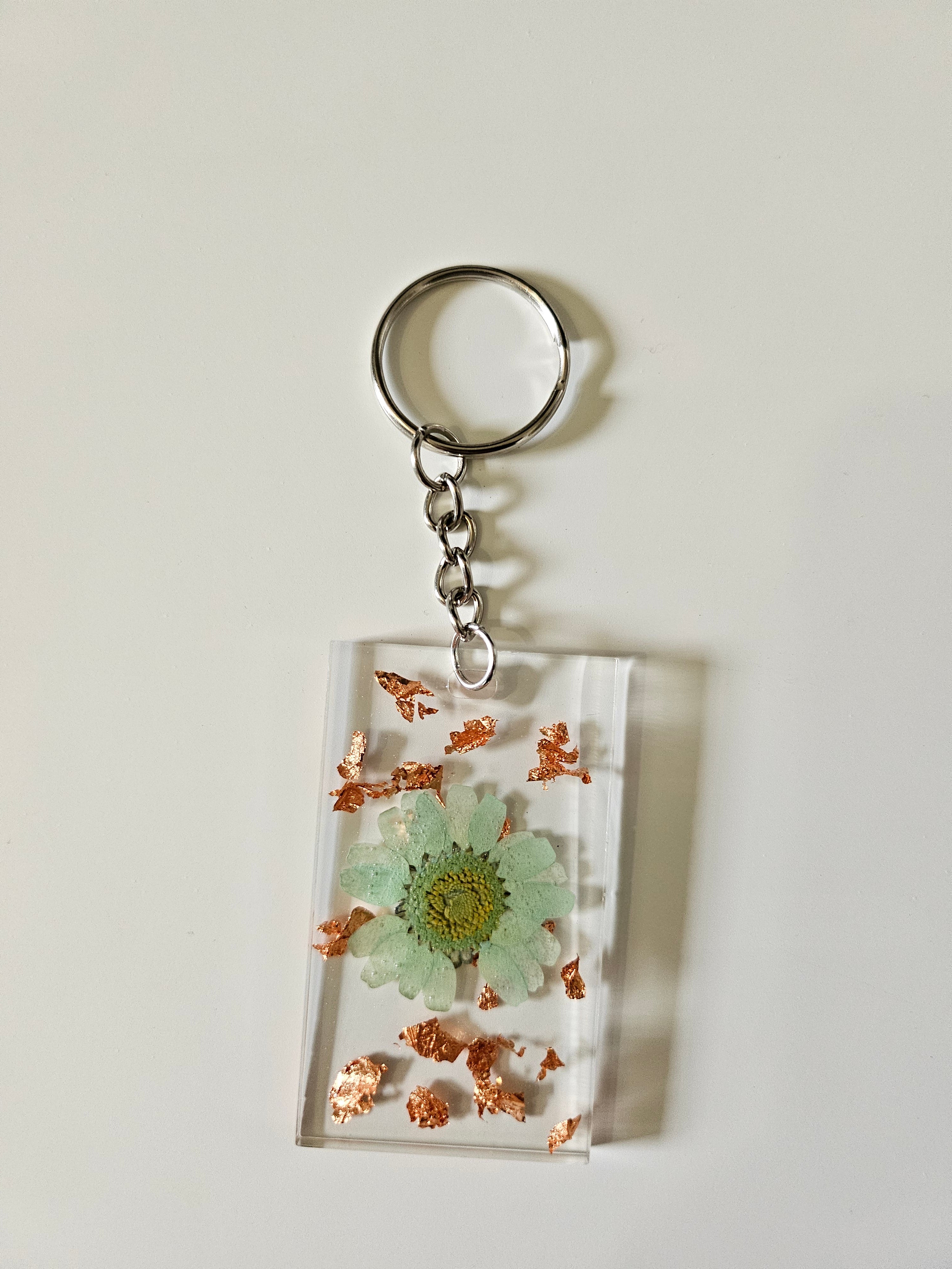 These Resin Pressed Flowers Keychains are handcrafted with real dried flowers suspended in crystal-clear resin.