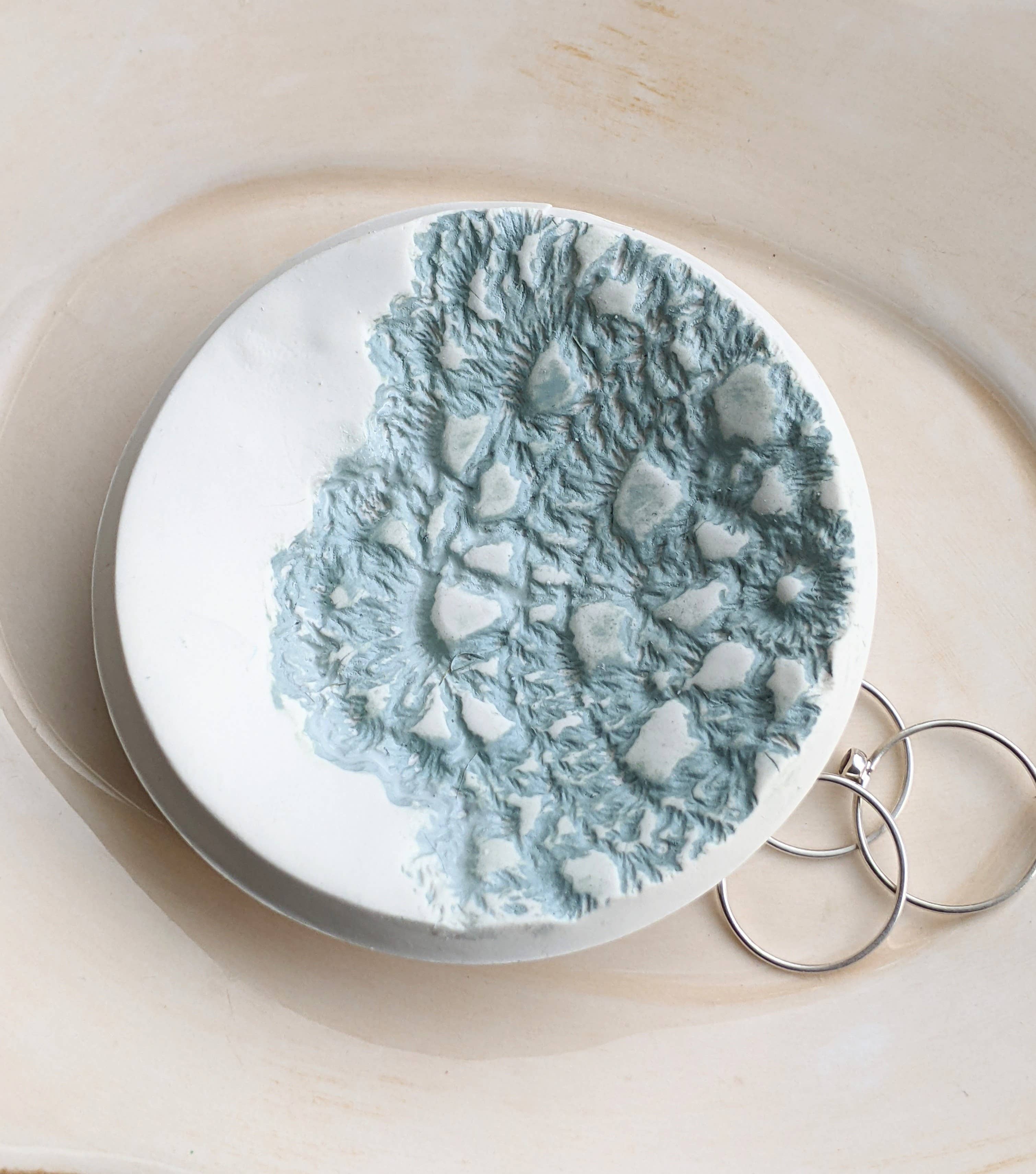 Handmade polymer clay dish with a green lace impression. Perfect as a jewelry or ring holder. Durable, decorative, and one-of-a-kind. Not food safe.
