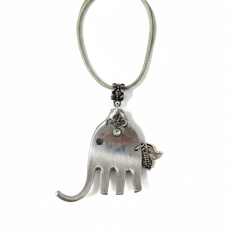Handcrafted silver elephant pendant made from vintage silverware. Symbolizes strength, wisdom & luck. Eco-friendly, one-of-a-kind, and artisan-made in the USA.