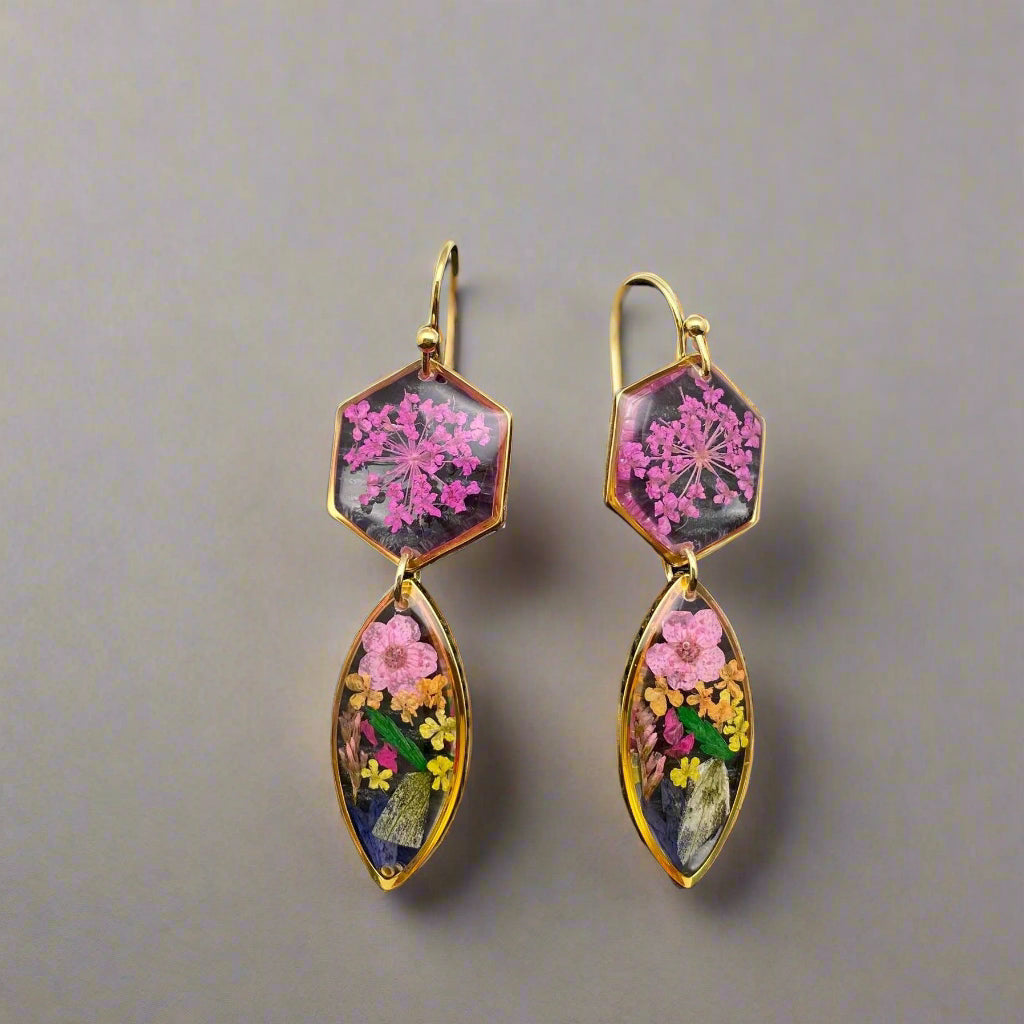 Handmade drop earrings with real pressed flowers in resin and 18K gold-plated stainless steel. Each 52mm pair is lightweight, elegant, and nature-inspired